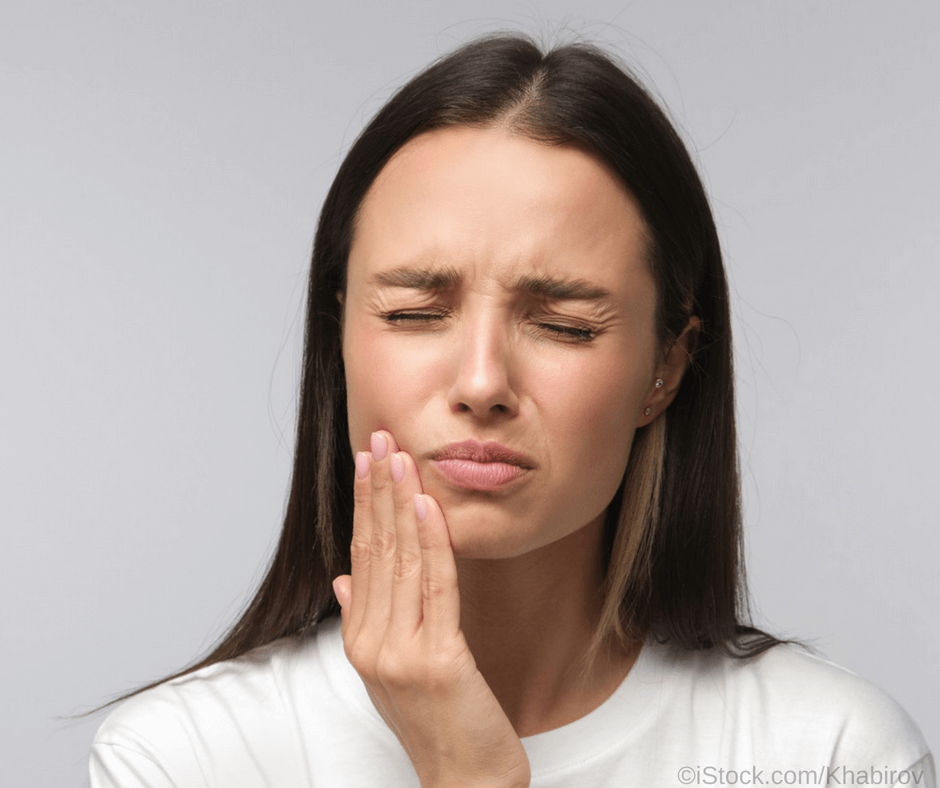 Zahnschmerzen bei einer entzündeten Zahnwurzel.